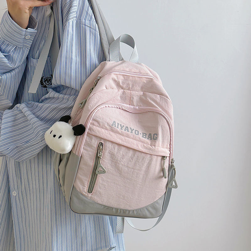 This is a lightweight and stylish summer travel and study backpack for children. It is a versatile cherry blossom pink mini backpack with a girlish heart full figure