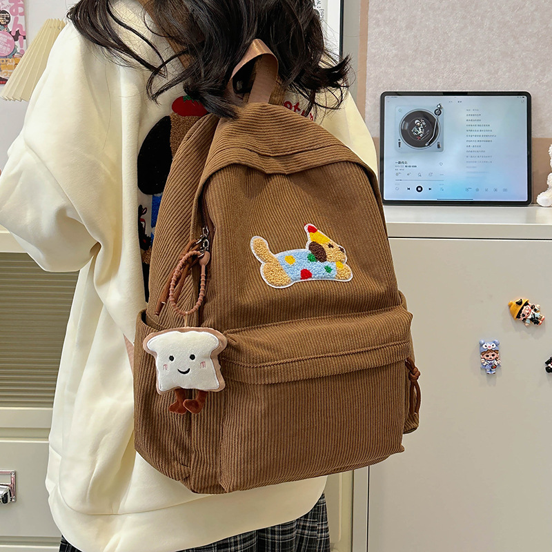 Japanese-style InS-style cute puppy schoolbag, female high school student corduroy backpack, casual college student campus backpack details Picture
