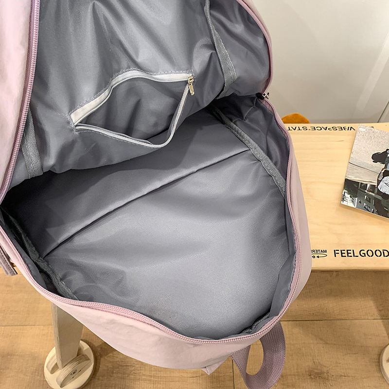 A lightweight, solid-color, simple and water-resistant casual travel backpack with a laid-back style from Korean Instagram Application Scenario
