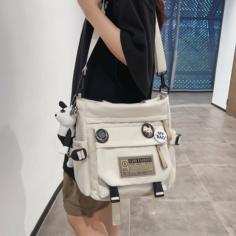 Japanese-style workwear retro single-shoulder bag, female college student commuting backpack for classes, large-capacity hand-held tutorial bag, crossbody bag details Picture