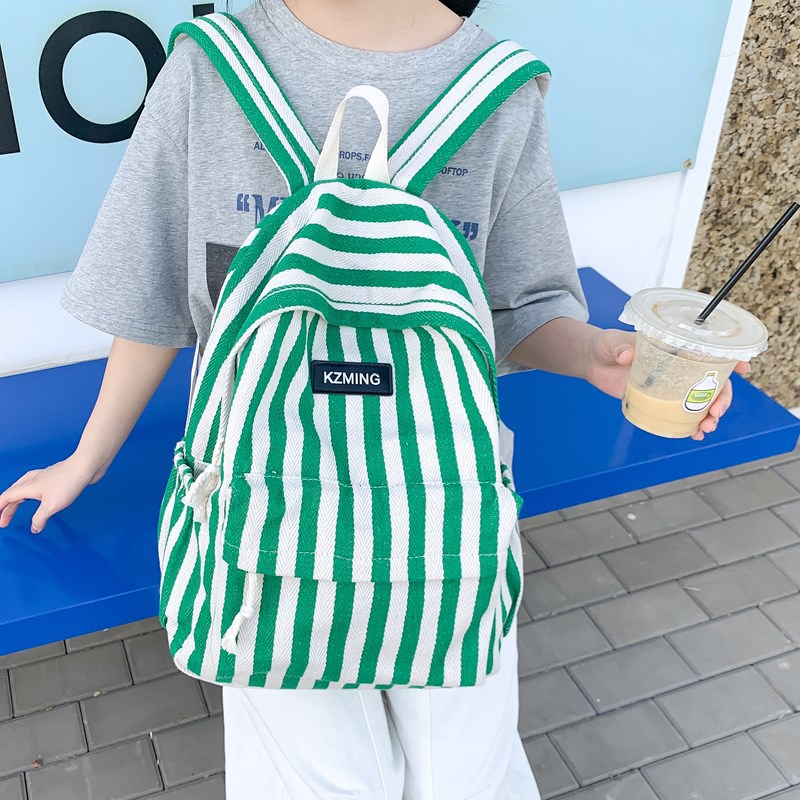 A new Korean-style striped backpack with a high aesthetic level and a college style. It is a casual, simple, lightweight and large-capacity backpack for junior and senior high school students full figure