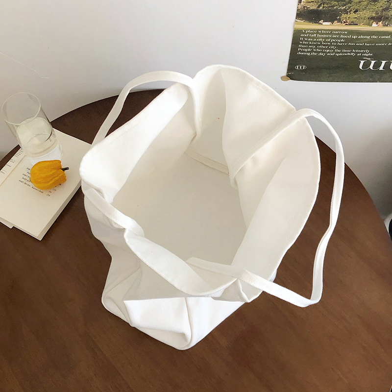 A new 2025 Korean style InS-style single-shoulder bag with a simple and casual large capacity tote bag. This is a versatile backpack in a niche solid color Application Scenario