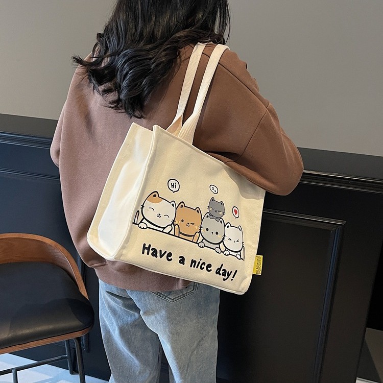 2025 New cute cat large-capacity student book tutorial bag, fashionable and casual single-shoulder bag, commuting handbag details Picture