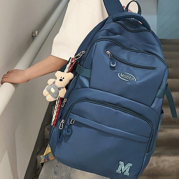 A new Japanese-style Instagram niche design solid-color simple backpack for couples, a casual and lightweight travel and hiking backpack details Picture