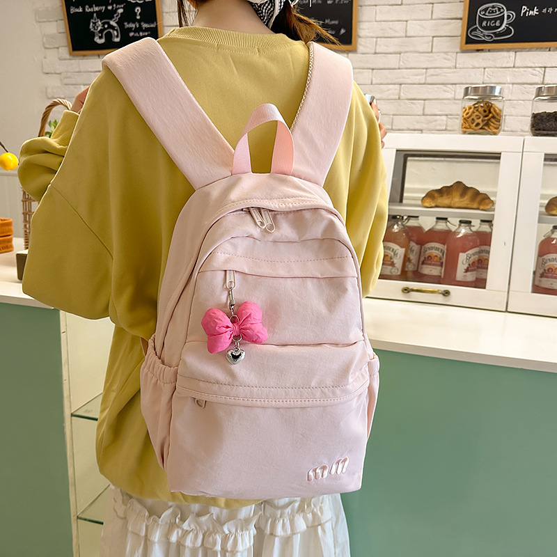 The new Instagram cute bow backpack is a niche and fresh schoolbag for junior and senior high school students and a lightweight travel backpack full figure