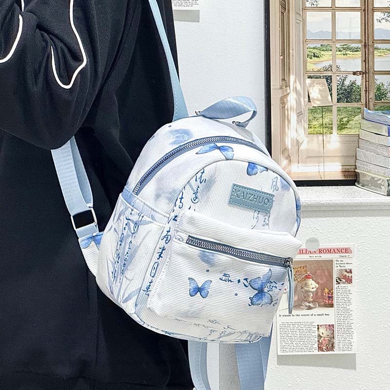 A new lightweight backpack for primary and secondary school students with a high aesthetic level, featuring a fresh and sweet Chinese style and butterfly print MINI backpack full figure