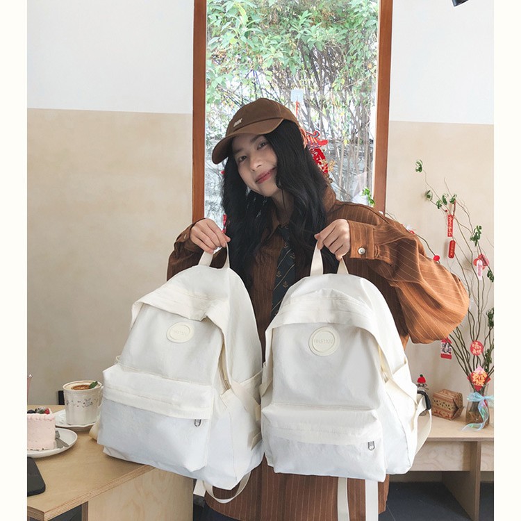 2025 New Japanese ins simple and versatile solid color backpack, lightweight and trendy backpack, casual schoolbag for grades 1-6 full figure