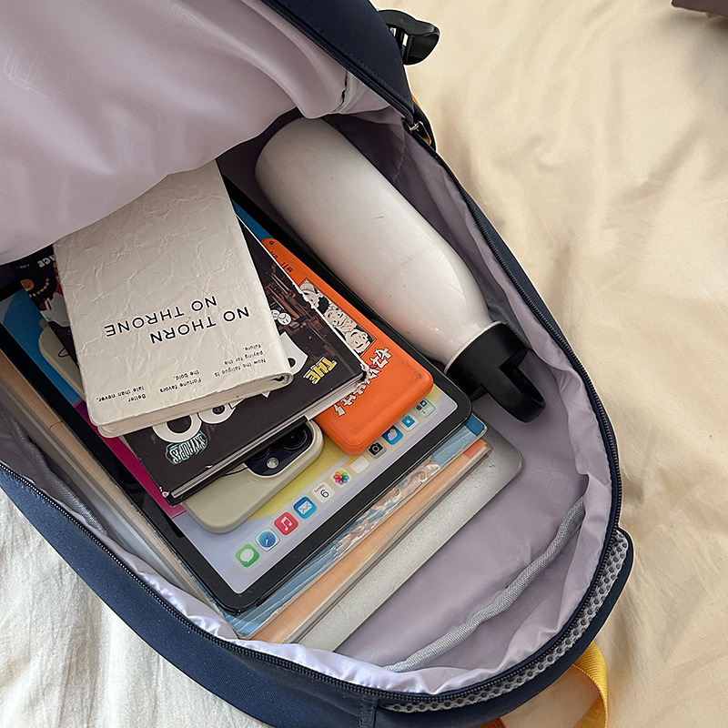 A new Korean-style ins casual and simple letter-themed large capacity backpack for couples and college students to travel easily Application Scenario