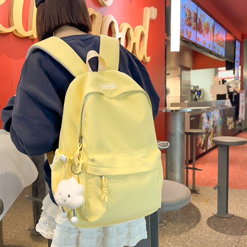 Fresh and sweet solid-color, versatile and simple schoolbag for junior and senior high school students, lightweight and large-capacity backpack for casual commuting outside full figure