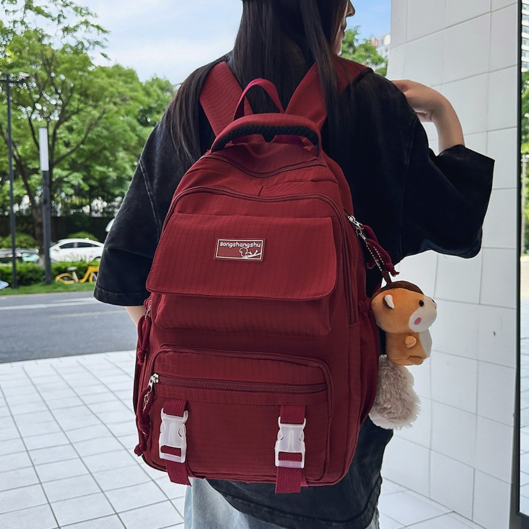 A new Korean-style ins solid-color backpack for couples, featuring a casual, simple, lightweight and versatile large-capacity backpack full figure