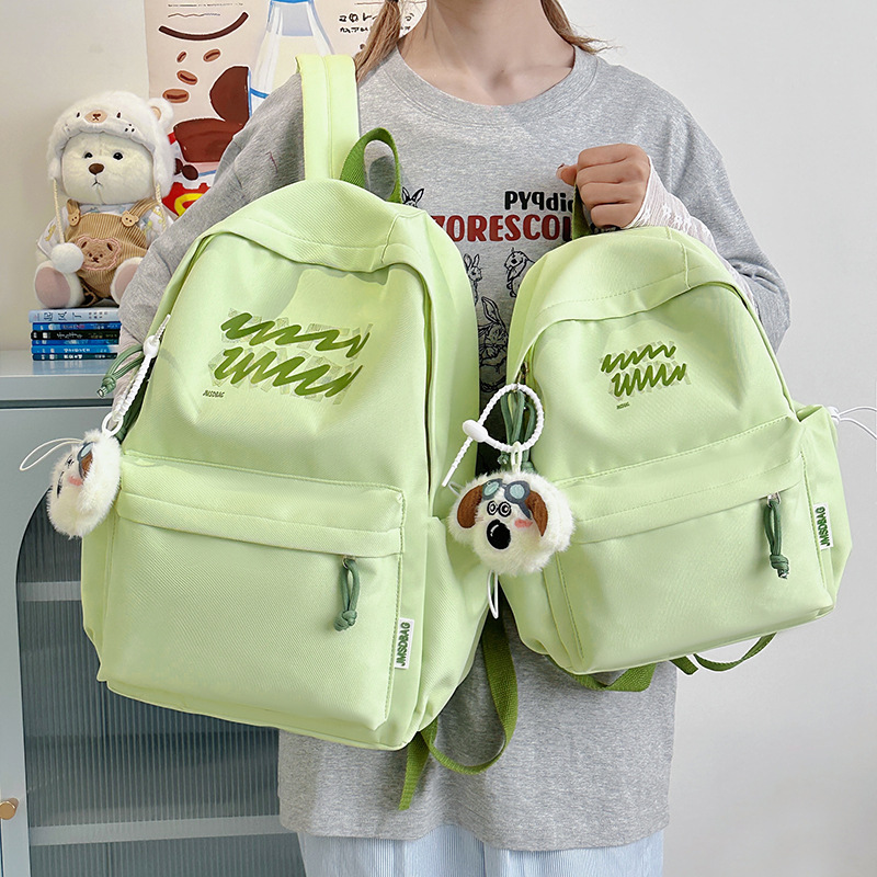 A new high-appearance-level Japanese ins fresh and sweet candy-colored backpack, a lightweight and large-capacity backpack for junior and senior high school students full figure