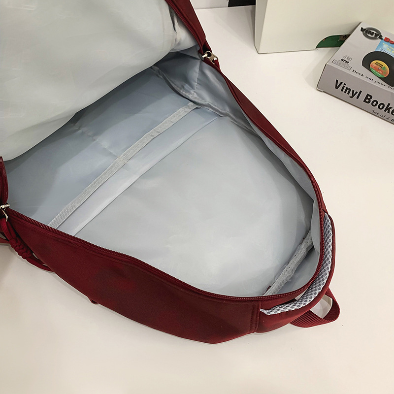 Large-capacity dark-patterned gradient color schoolbag for junior high school girls, high school and college students, light travel backpack for boys Application Scenario