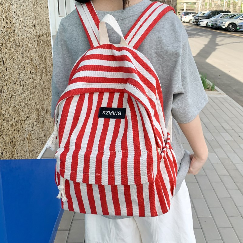 A new Korean-style striped backpack with a high aesthetic level and a college style. It is a casual, simple, lightweight and large-capacity backpack for junior and senior high school students details Picture