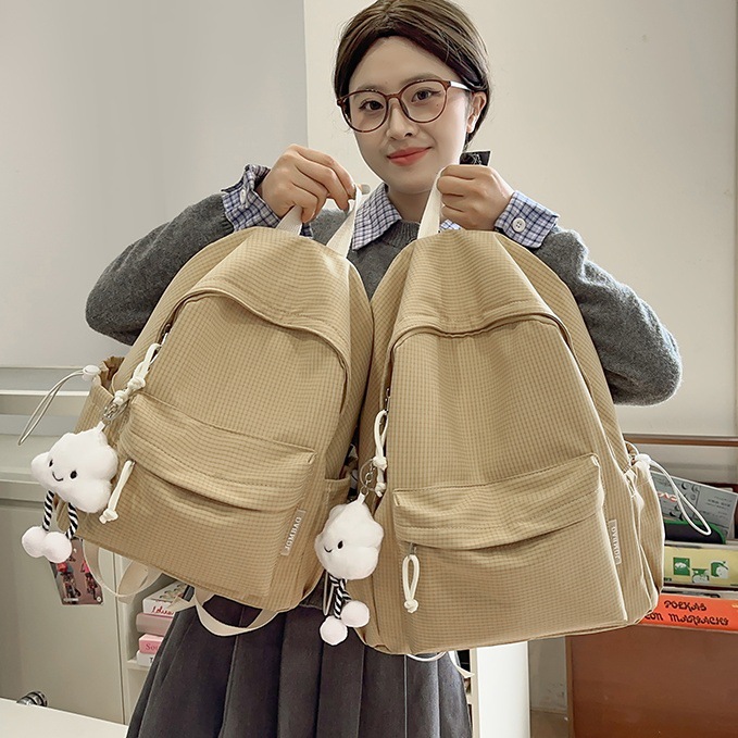 College student schoolbags, simple, lightweight and versatile checkered backpacks for female junior high school students, high school student class bags, travel backpacks full figure