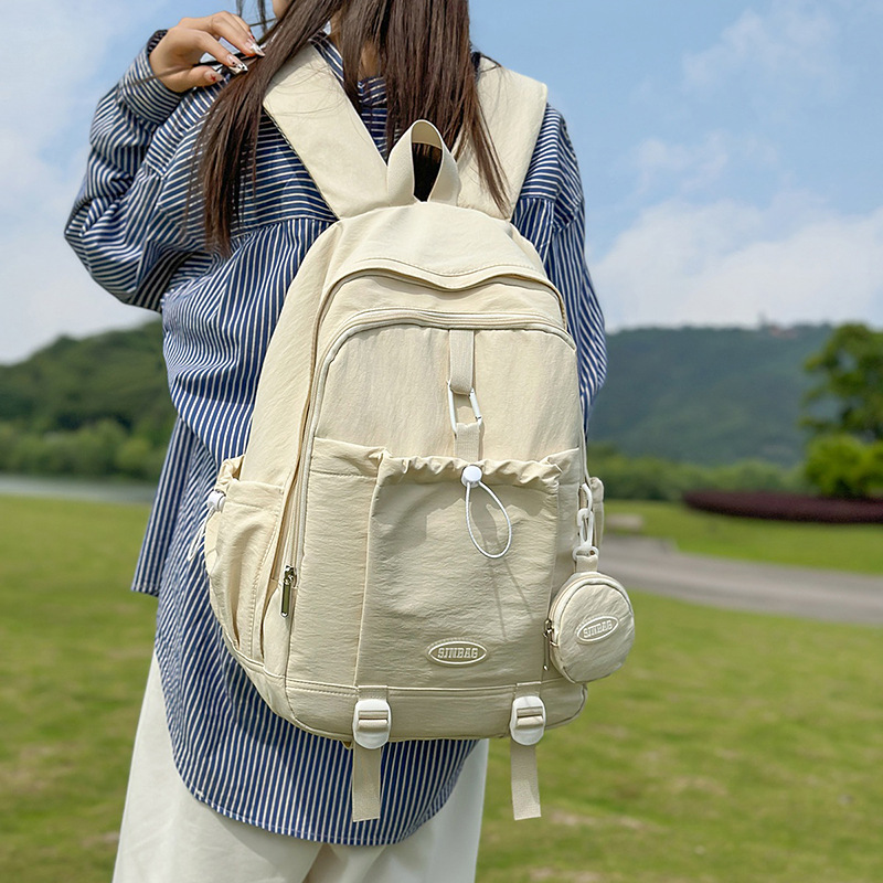 A new high-appearure-level Japanese ins fresh, sweet and cute backpack for student girls in solid color with drawstring and large capacity full figure