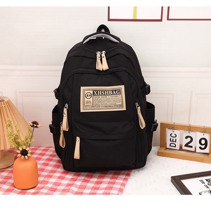 Cross-border foreign trade student backpacks for men and women, new casual backpacks, simple Korean version schoolbags for junior high school, senior high school and college students full figure