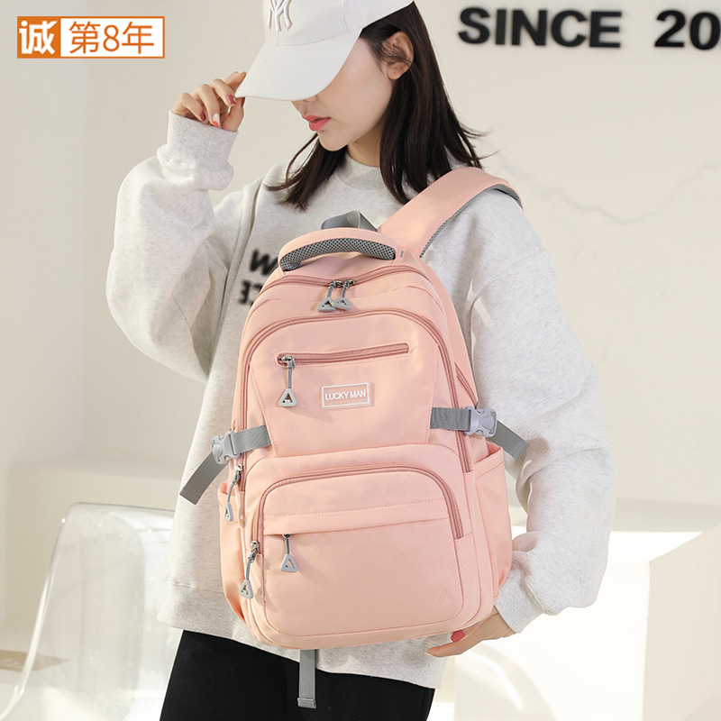 This is a new 2024 model of water-resistant backpack for students in grades three to six. It is a large-capacity, simple travel backpack full figure