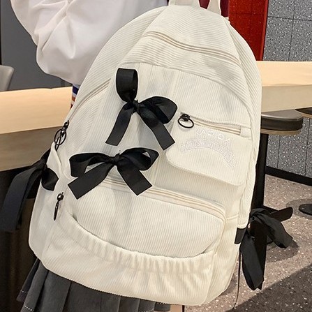 Ins-style bow schoolbag, corduroy for girls, popular backpack for junior high school and primary school students, large-capacity niche backpack full figure
