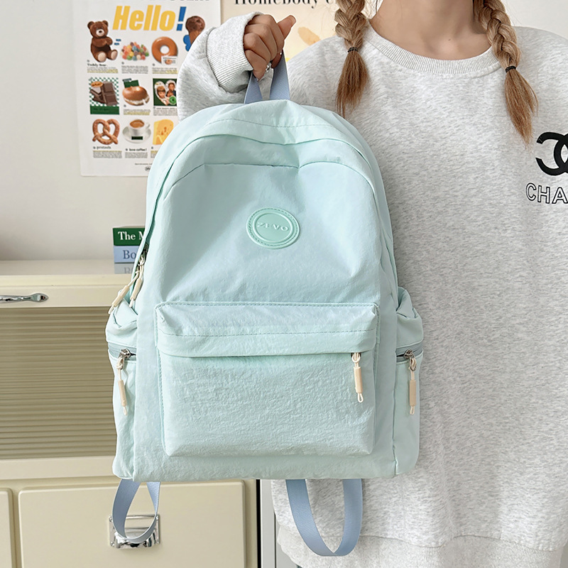 Spring new casual backpack for women, simple and lightweight commuting travel backpack, large-capacity schoolbag for junior and senior high school students full figure