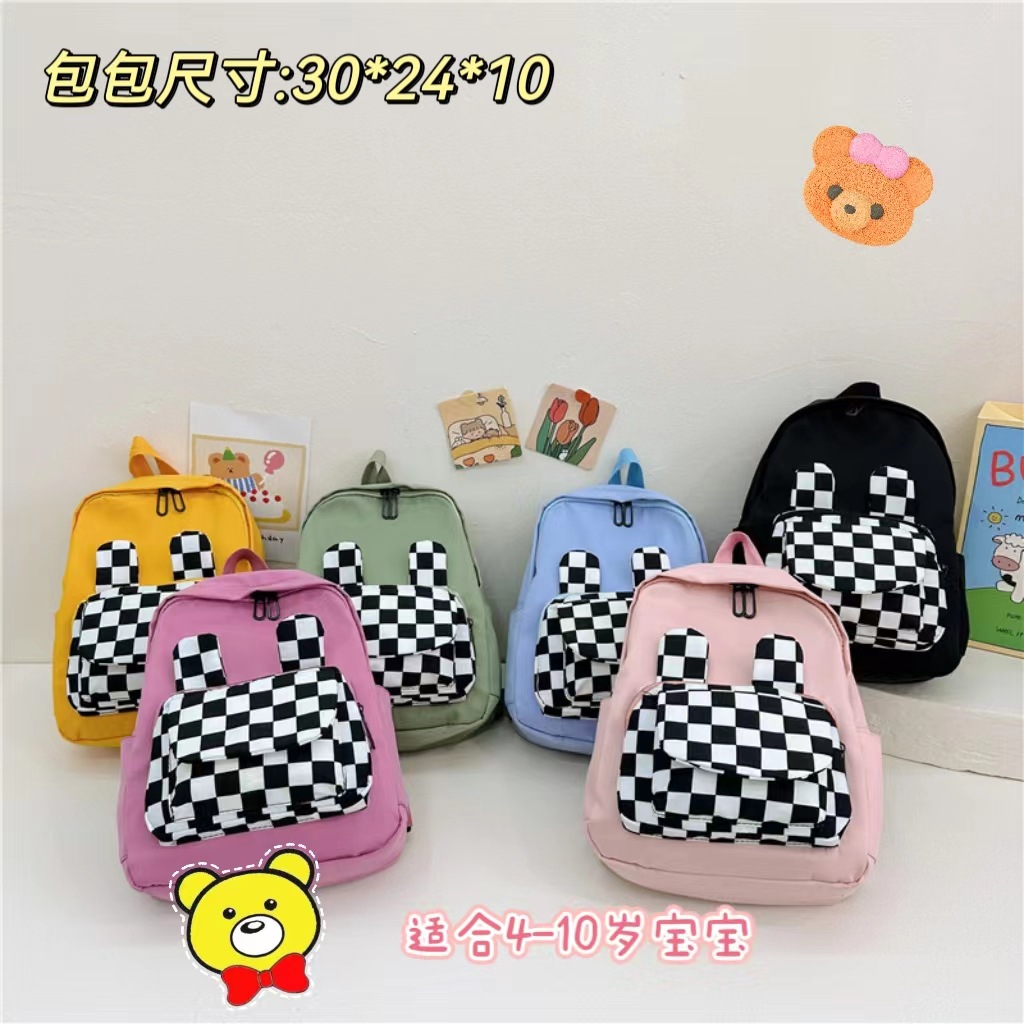 The 2023 new autumn student backpack with a checkerboard pattern and rabbit ears features a large capacity, high appearance level and versatile backpacks full figure