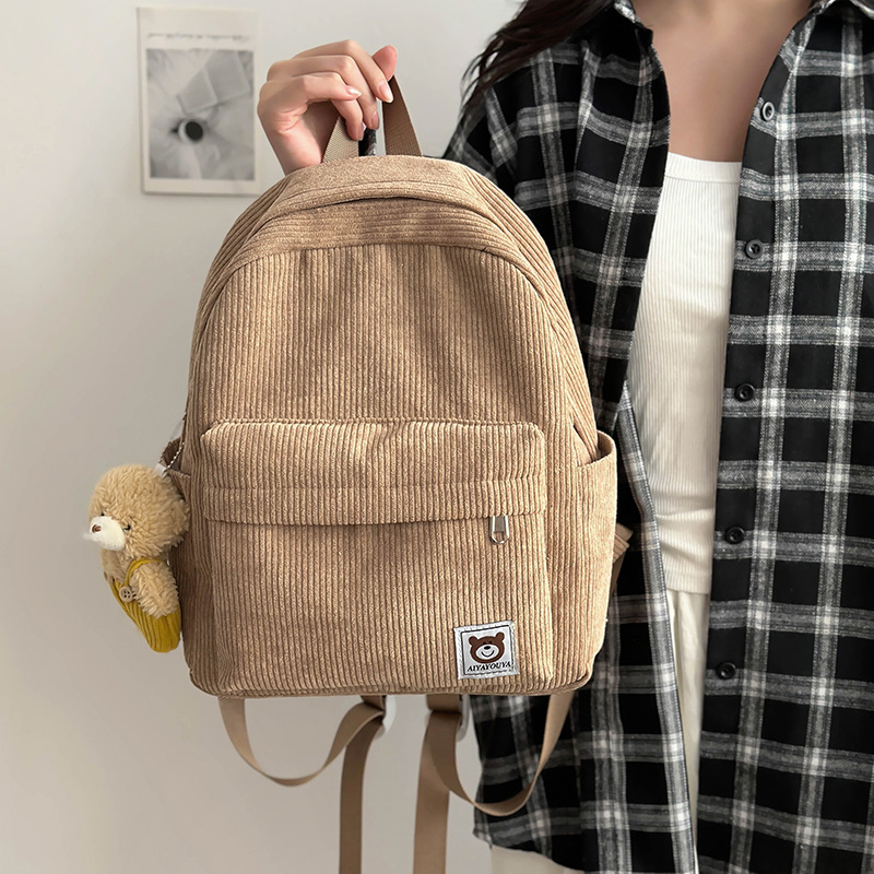 A new type of cute children's backpack with corduroy solid color, retro and simple style, featuring high appearance standards for autumn travel and study Tours full figure