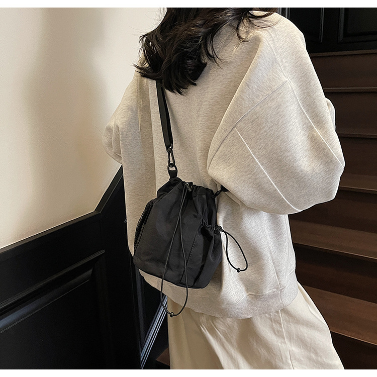 Simple solid color casual and versatile, lightweight and versatile, single-shoulder underarm bag with drawstring closure, portable large capacity bucket bag for women full figure