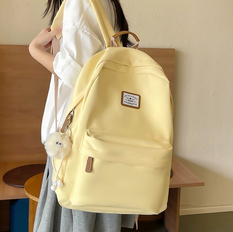 The new Korean-style backpack for women is a versatile solid-color schoolbag with a simple and niche ins style. It is a lightweight and casual backpack for college students full figure