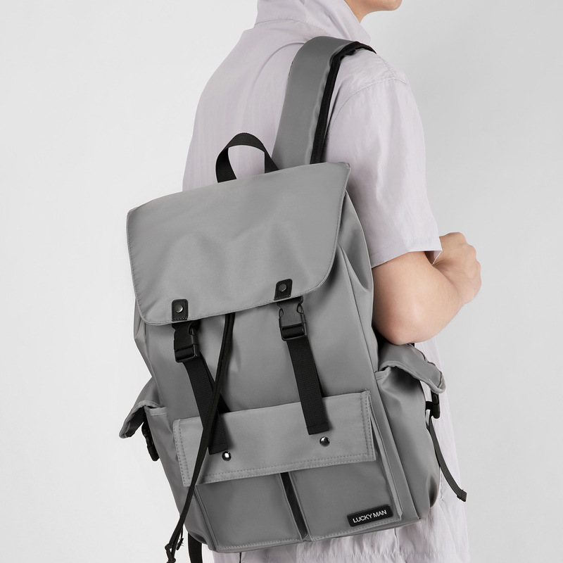 A new high-appearation-level solid color simple sports backpack storage bag for men, a lightweight travel and mountaineering large-capacity backpack details Picture