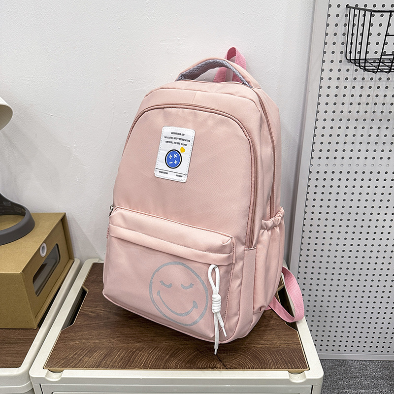 The 2024 new style of fashionable and simple backpacks for trendy boys and girls, large-capacity schoolbags for students, and cute smiling face printed backpacks Specification drawing