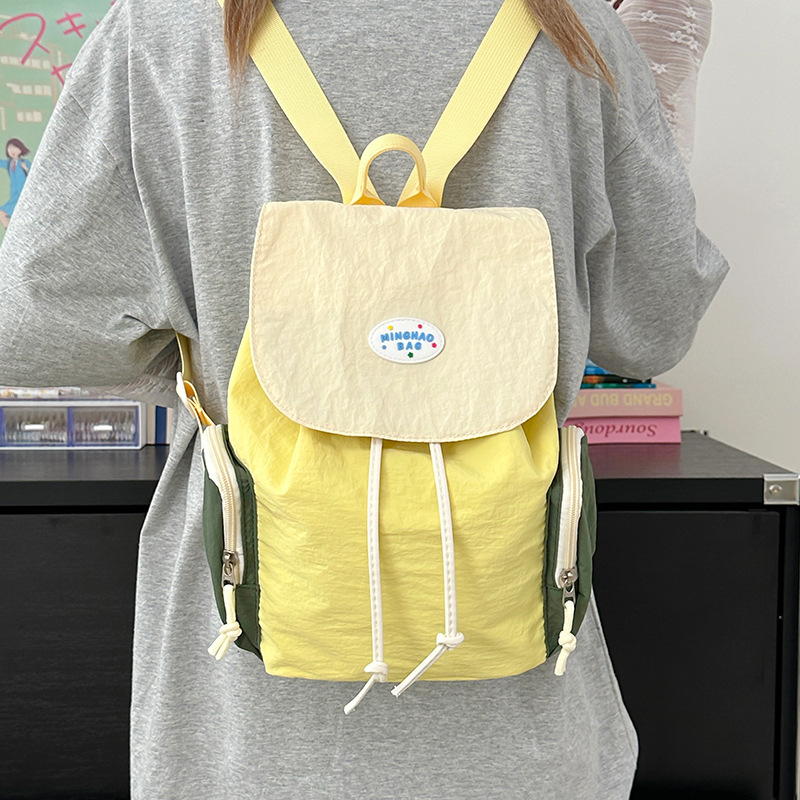 A new high-appearance-level, fresh and sweet backpack from Forest-themed ins. It features a color-blocking, lightweight, simple and large-capacity backpack for women details Picture