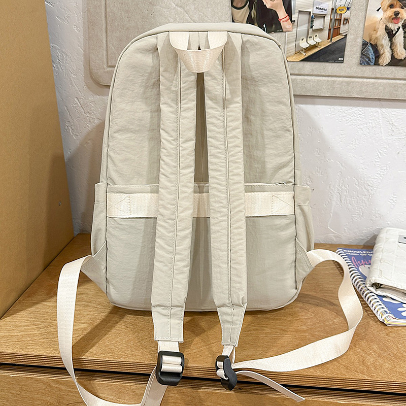 A new minimalist Japanese-style ins solid color backpack for college students, a casual campus schoolbag, and a versatile lightweight backpack for travel Specification drawing