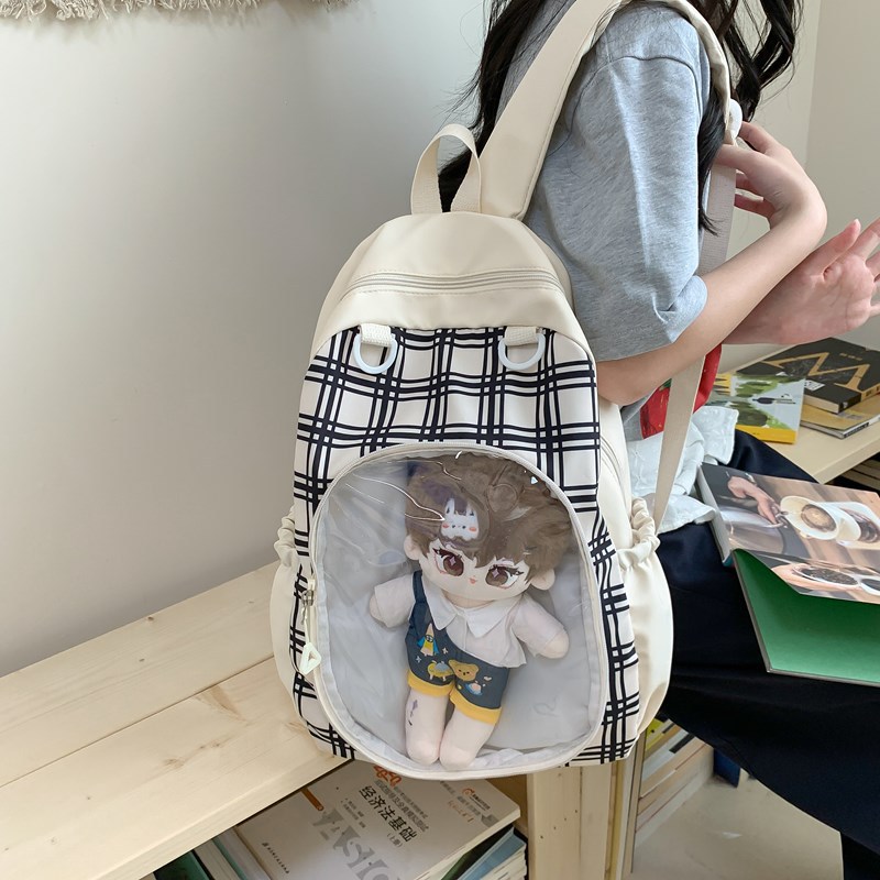 A new Japanese-style, high-appearance-level cute doll detachable transparent smug pain bag, a versatile commuting backpack for girls full figure