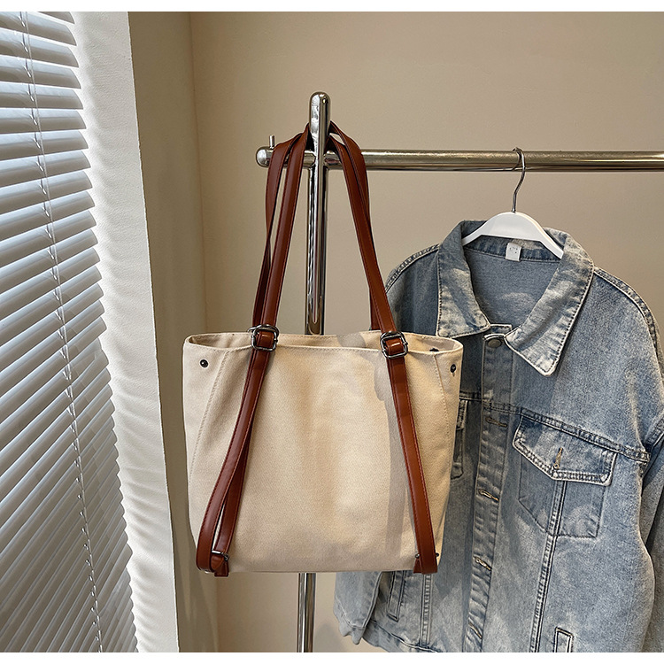 2025 New stylish and versatile canvas tote bag, large-capacity school commuting backpack, casual and simple backpack Application Scenario