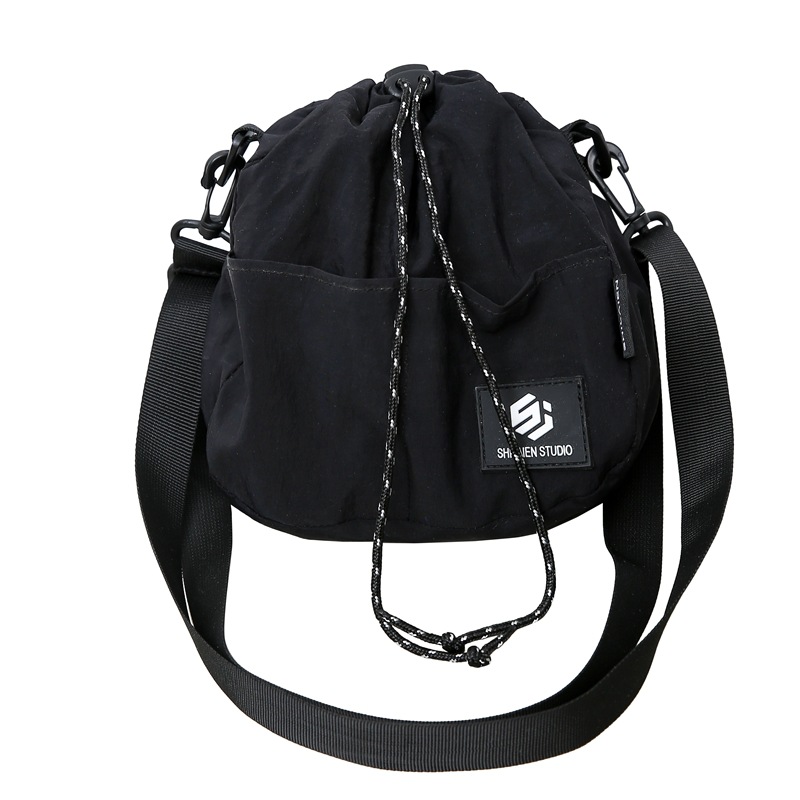 A new Korean-style Instagram streetwear bag with a high level of appearance and a cool drawstring opening. It is a casual, simple and lightweight travel crossbody bag Item Picture