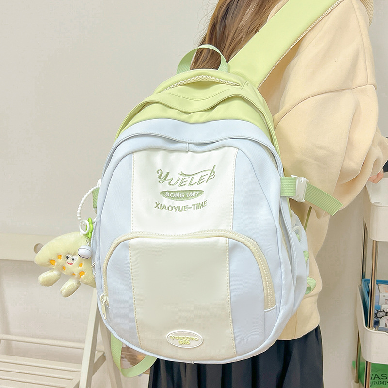 A new high-appearance-level, fresh and sweet color-blocking backpack from Japanese ins, a lightweight travel backpack for junior and senior high school students details Picture