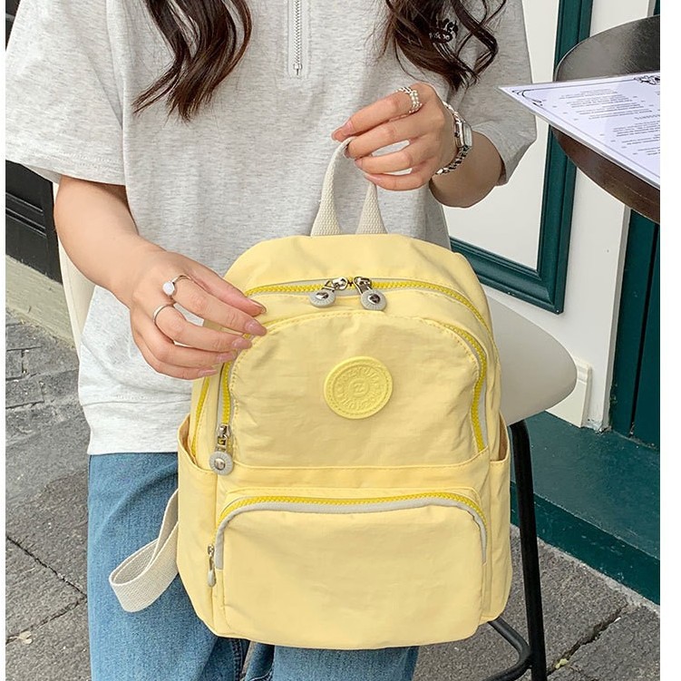 A casual and versatile mini backpack for foreign trade, a Japanese-style ins lightweight and high-appearance-level soft and creamy yellow travel backpack full figure