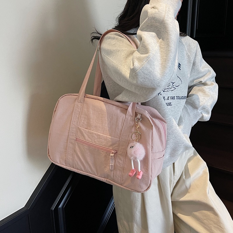 Niche lightweight travel bags, large-capacity casual Korean-style fitness bags, solid-color versatile backpacks, simple commuting tote bags full figure