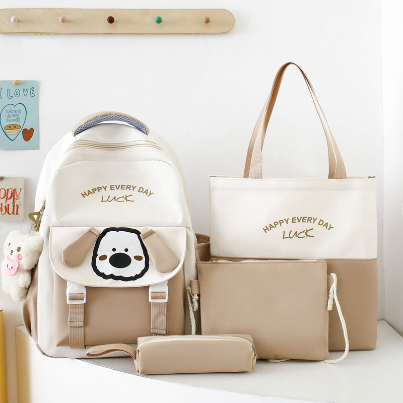 Cute and stress-relieving new schoolbag for primary school students, cartoon dog, casual junior high school student four-piece set, girls' backpack details Picture