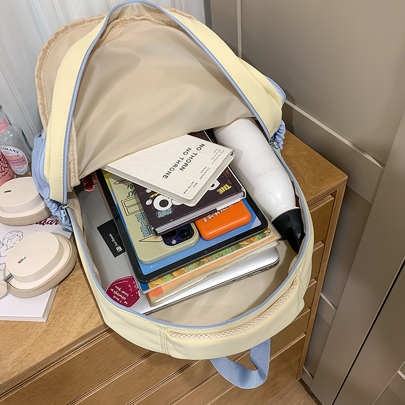 A lightweight and large-capacity backpack for women, a new Japanese-style high-appearance-level school style backpack with multiple compartments, fresh and cute for class Application Scenario