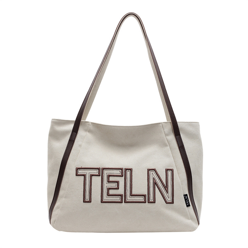 Large-capacity canvas tote bag for women, 2025 new style casual single-shoulder bag, large bag for school commuting, and handbag for going out Item Picture
