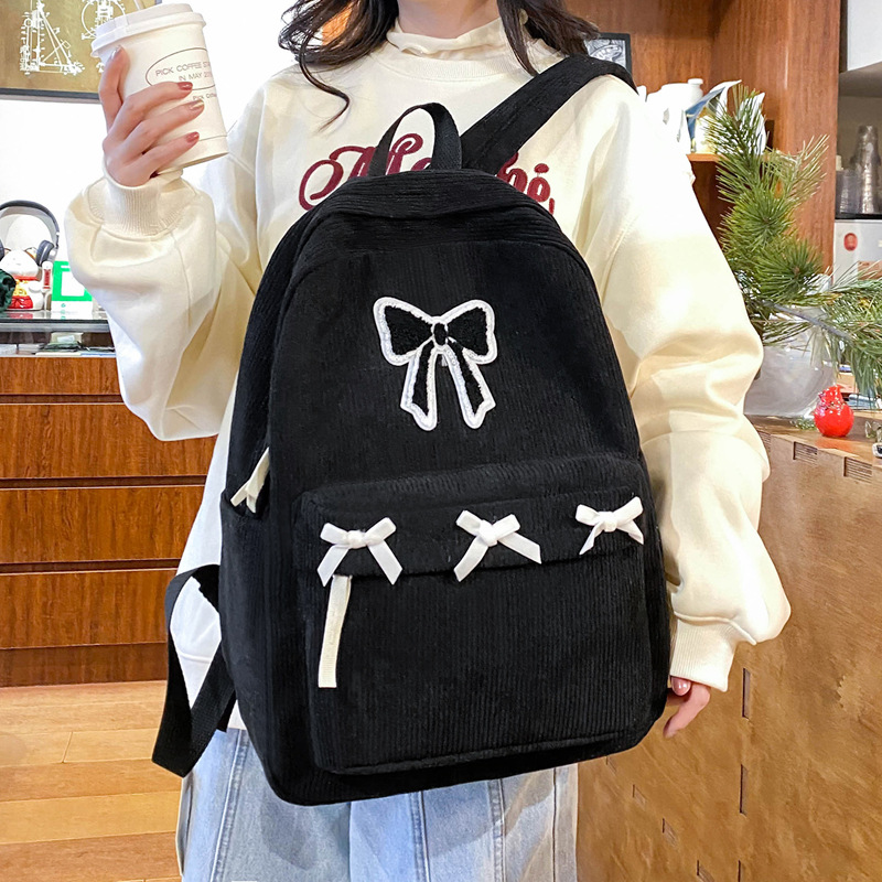 2024 New schoolbag for junior high school girls, high appearance level bow backpack, down and laid-back style college student backpack for girls details Picture