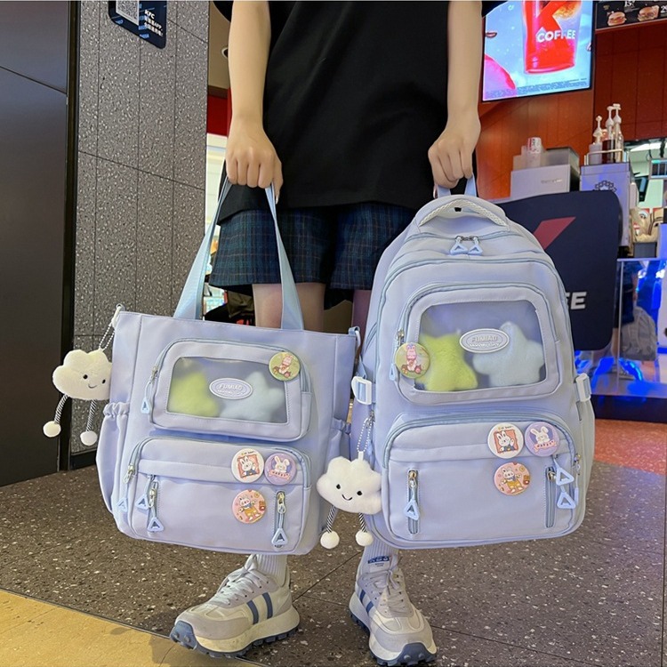 This is a fresh and cute backpack for children and primary school students in grades 3 to 6. It has a sweet style and a solid color with a transparent layer details Picture