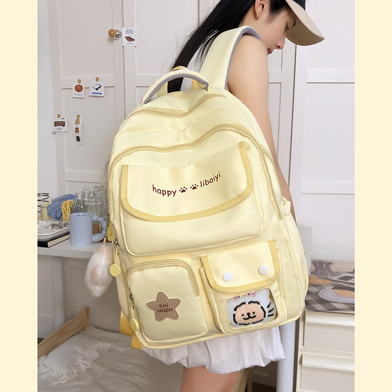Wholesale of pure color backpacks for female junior high school students with a fresh and simple Korean school style and multi-layered design Application Scenario