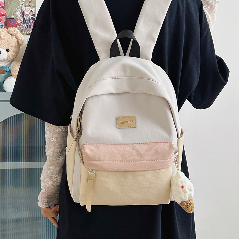 The new forest-themed ins high-appearance-level fresh, sweet and cute color-blocking backpack is a casual and lightweight backpack for junior and senior high school students full figure