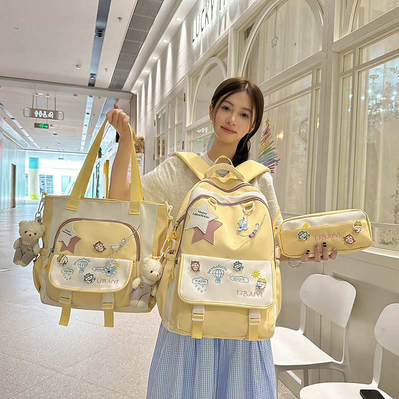 A new high-appearance-level Japanese-style fresh, sweet and cute large-capacity backpack for junior and senior high school students, a simple three-piece set with contrasting colors full figure