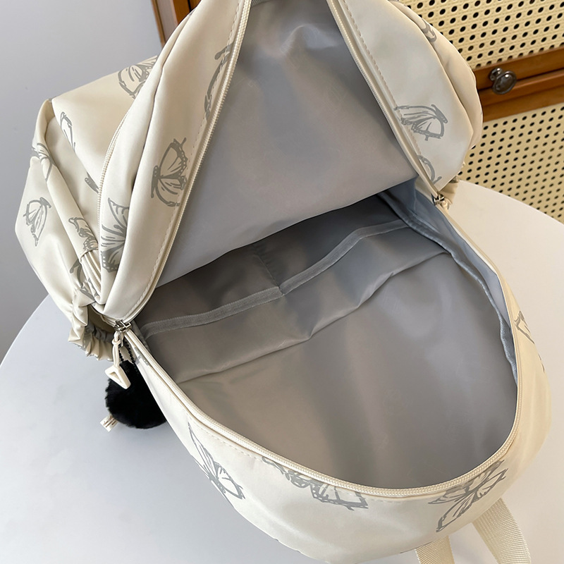 Japanese-style InS-style butterfly print backpacks for girls, junior high school, senior high school and college students, large-capacity computer travel backpacks Application Scenario