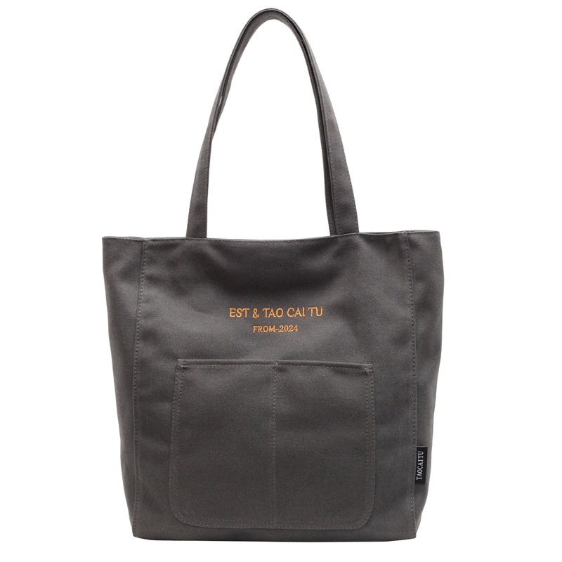 A simple and large-capacity canvas bag for women, a new model of 2025 for college students. It is a versatile single-shoulder tote bag for class and commuting to work Item Picture