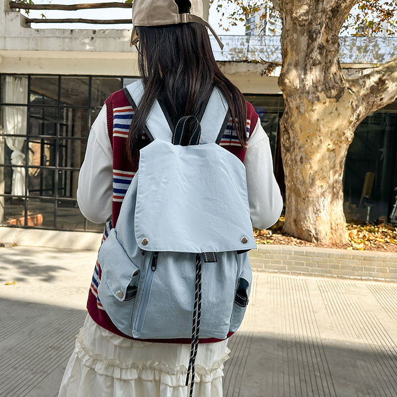 American-style ins flip-top schoolbag, simple and versatile backpack, lightweight solid-color backpack, travel and leisure drawstring single-shoulder bag full figure