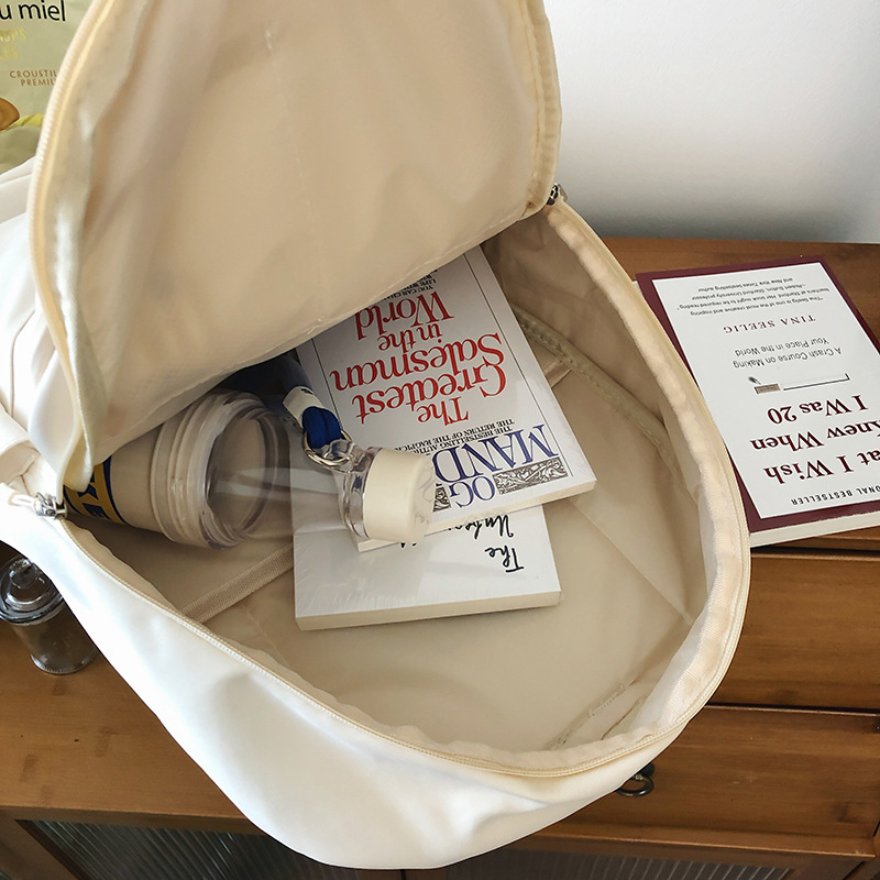 A new solid-color Korean-style casual backpack for junior high school students in an ins style Application Scenario