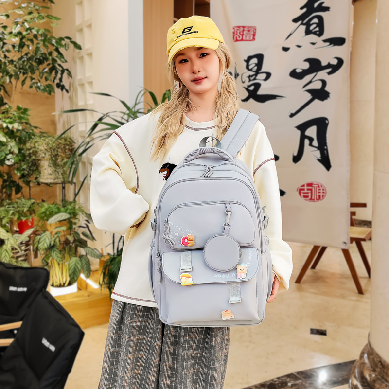 The 2025 new large-capacity, versatile, solid-color backpack for junior and senior high school students is a simple and multi-layered backpack for casual commuting details Picture